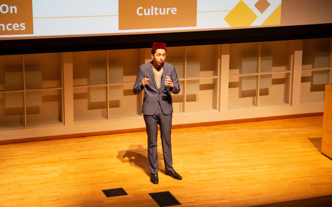 Man pitches his business on a stage