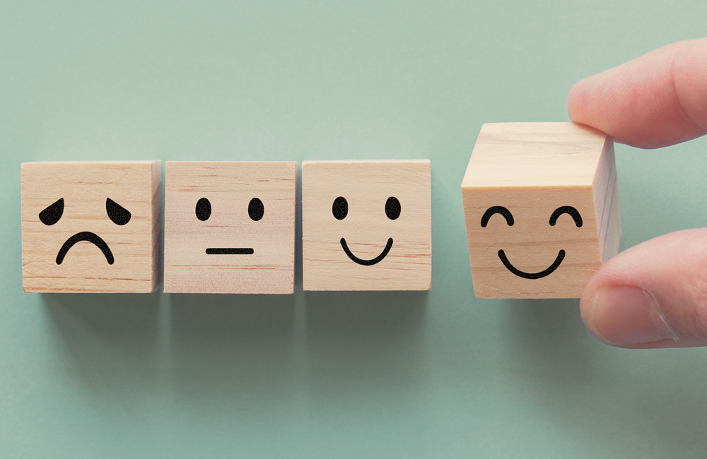 Wooden blocks with expressions help children express their emotions.